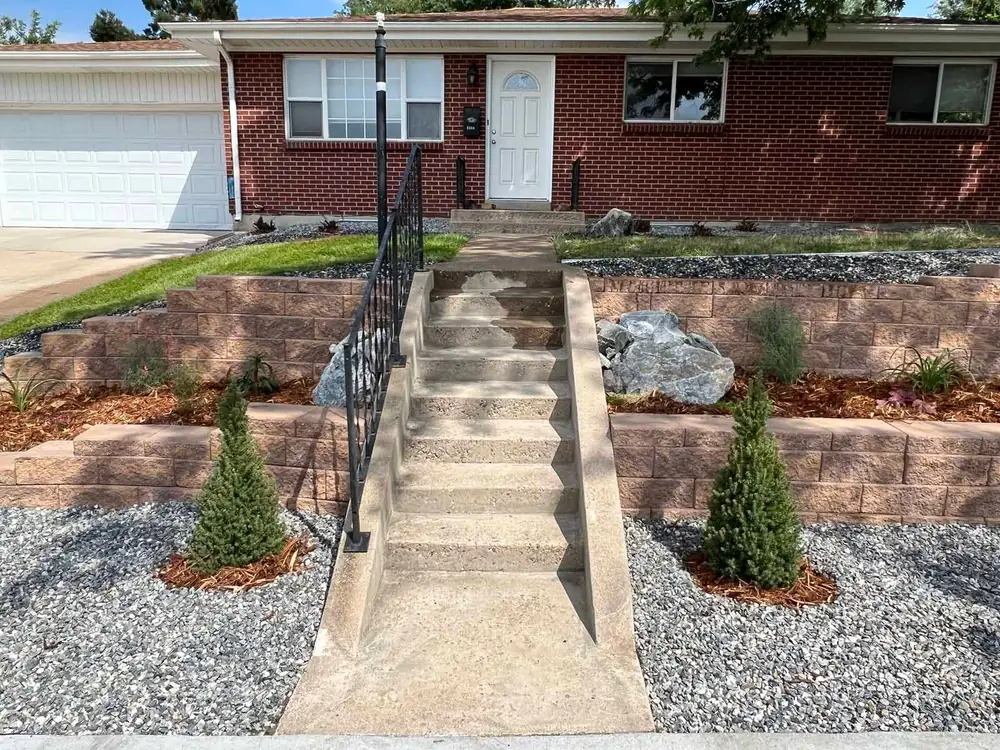 Front walk and steps between two terraced block planters